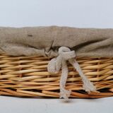 Braided rattan pan-maker bread basket covered with linen fabric