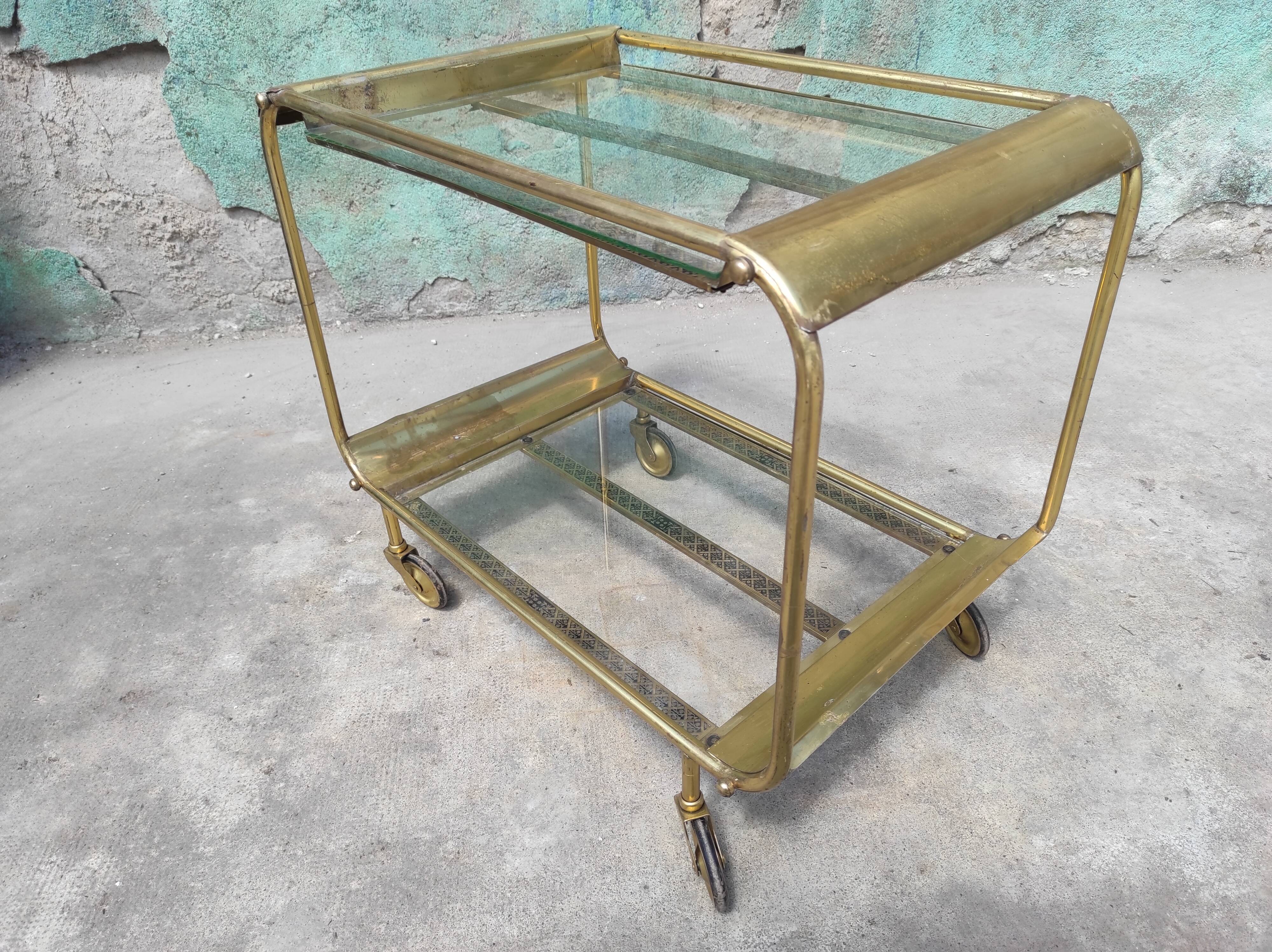 Old rolling coffee table serving vintage brass bar 50s mid-century design