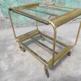 Old rolling coffee table serving vintage brass bar 50s mid-century design