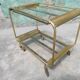 Old rolling coffee table serving vintage brass bar 50s mid-century design