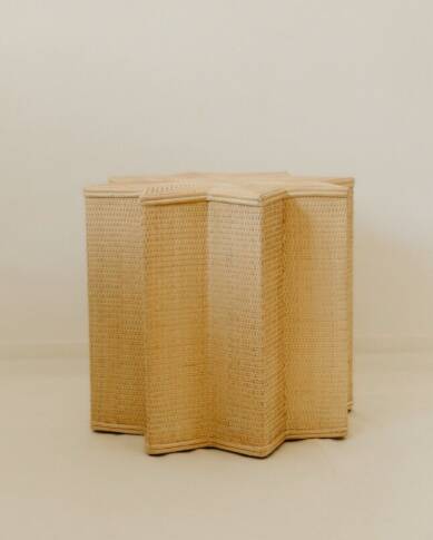 Small star-shaped side table in cream-colored rattan
