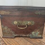 Old Indian wooden wedding chest decorated with chiseled brass plaque. India late 19th/early 20th