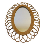 Vintage oval rattan mirror from the 60s and 70s with a rosette