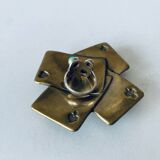 Empty pocket square of aces in brass