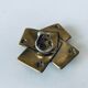 Empty pocket square of aces in brass
