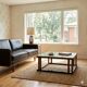 Vintage wooden coffee table with paint and glass, design from the 1940s-50s.