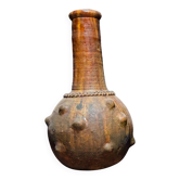 Glazed terracotta spherical jar, raised nails