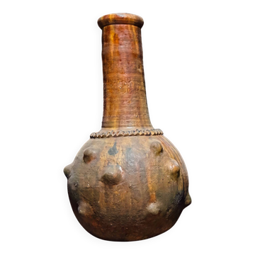Glazed terracotta spherical jar, raised nails