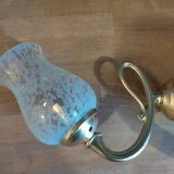 Wall light with golden metal tulip support, pockmarked glass