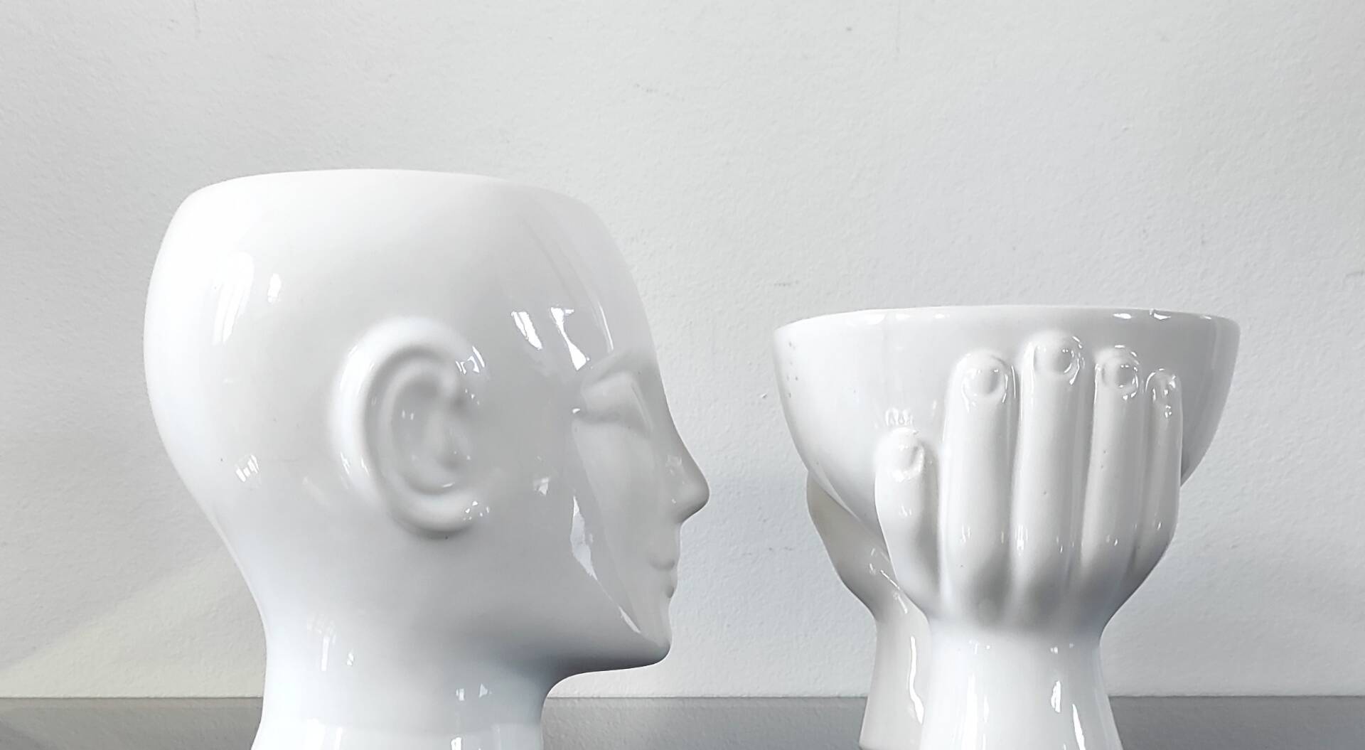 A pair of vintage ceramic plant pots.