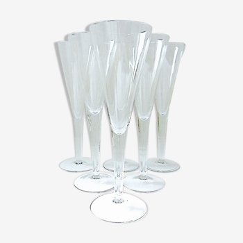 Suite of six colorless crystal champagne flutes