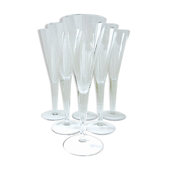 Suite of six colorless crystal champagne flutes