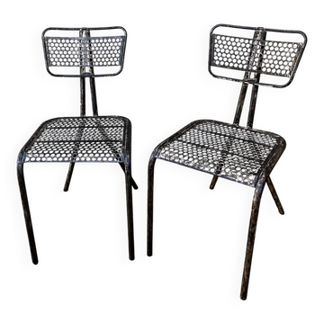 Pairs of perforated metal chairs by René Malaval