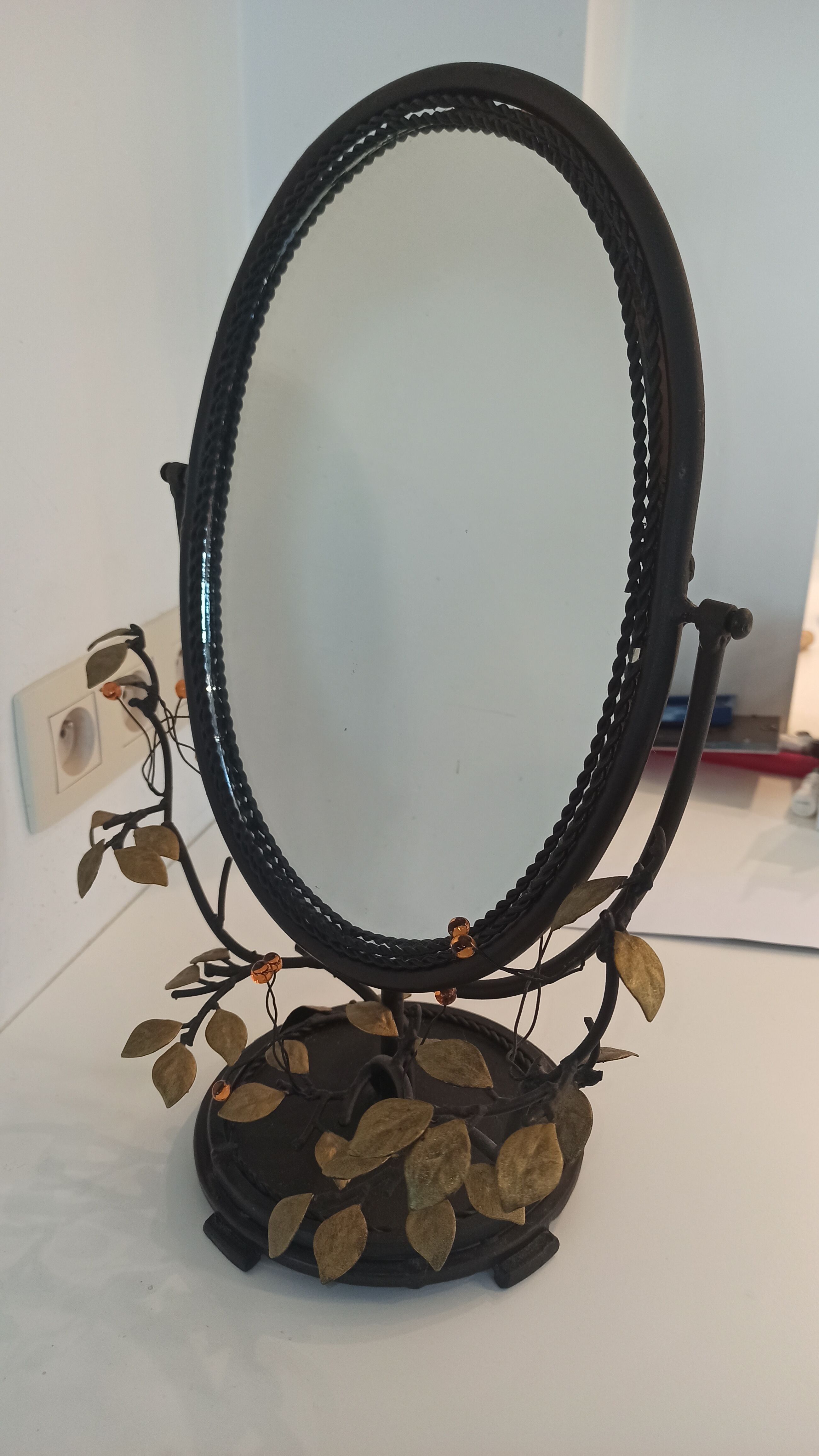 Table mirror, tilting psyche in patinated bronze decorated with leaves and fruits