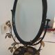 Table mirror, tilting psyche in patinated bronze decorated with leaves and fruits