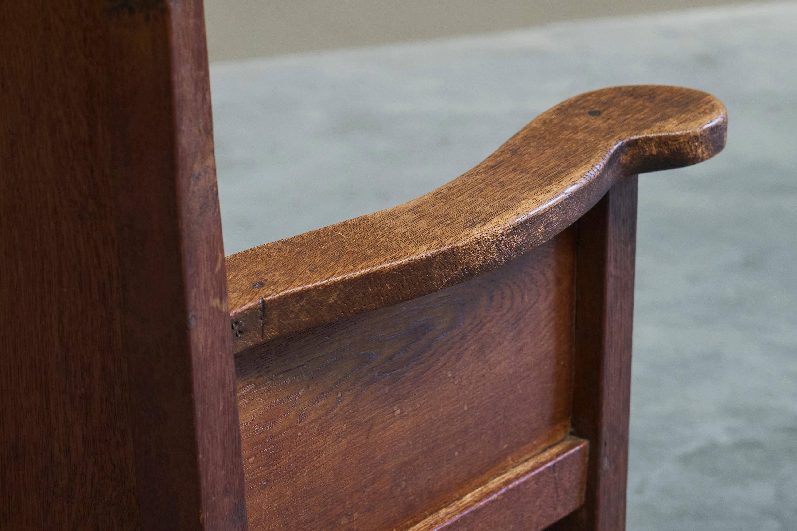 Antique solid oak armchair, 19th-century farmer style.
