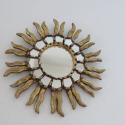 Golden wooden sun mirror with inlays from the early 20th century.