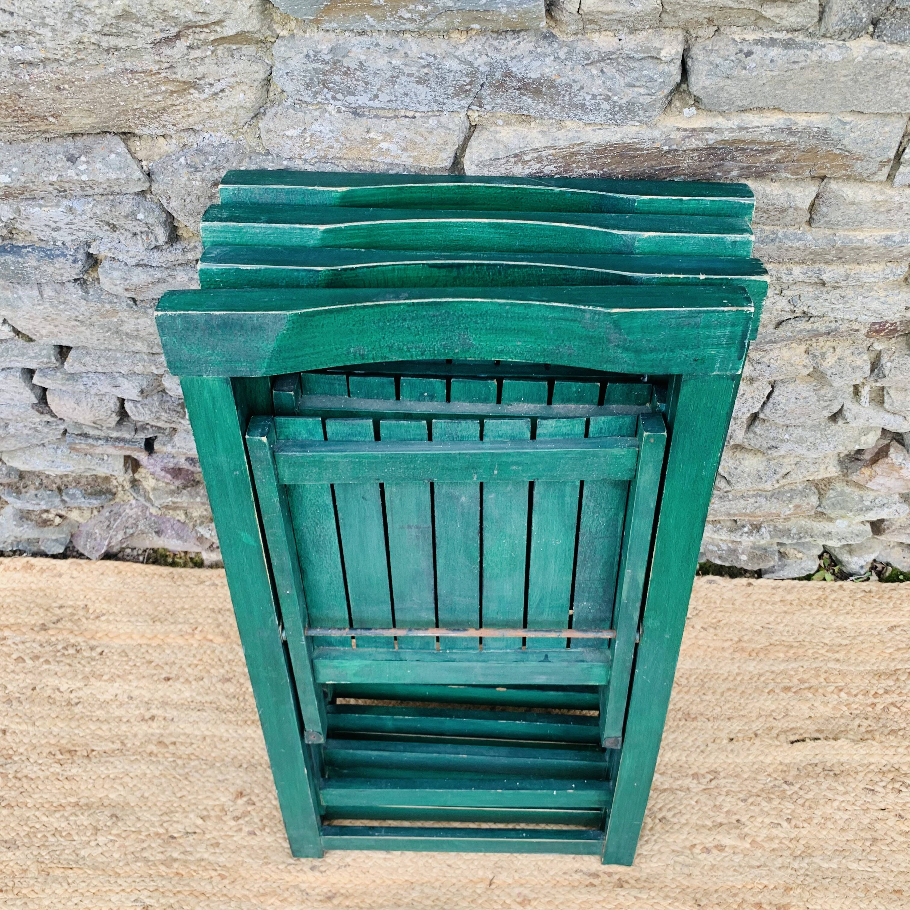 Set of 4 green folding chairs