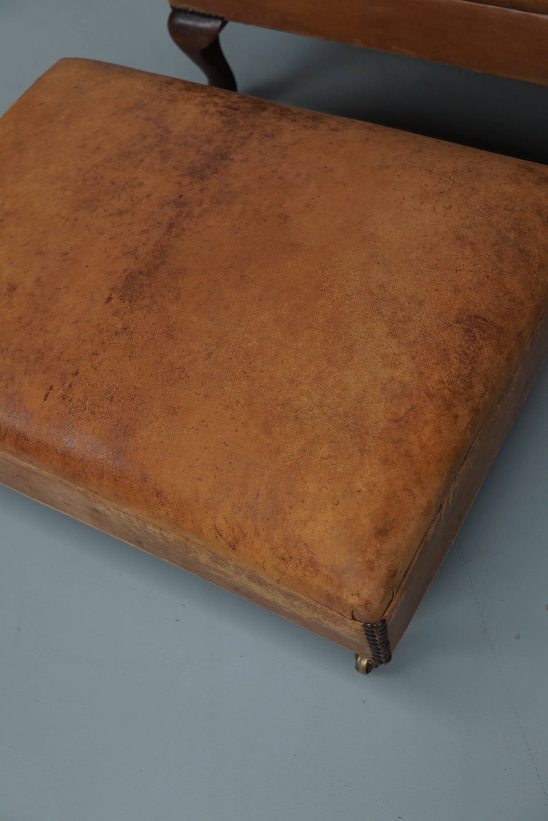 Vintage Dutch cognac coloured leather club chair, with footstool