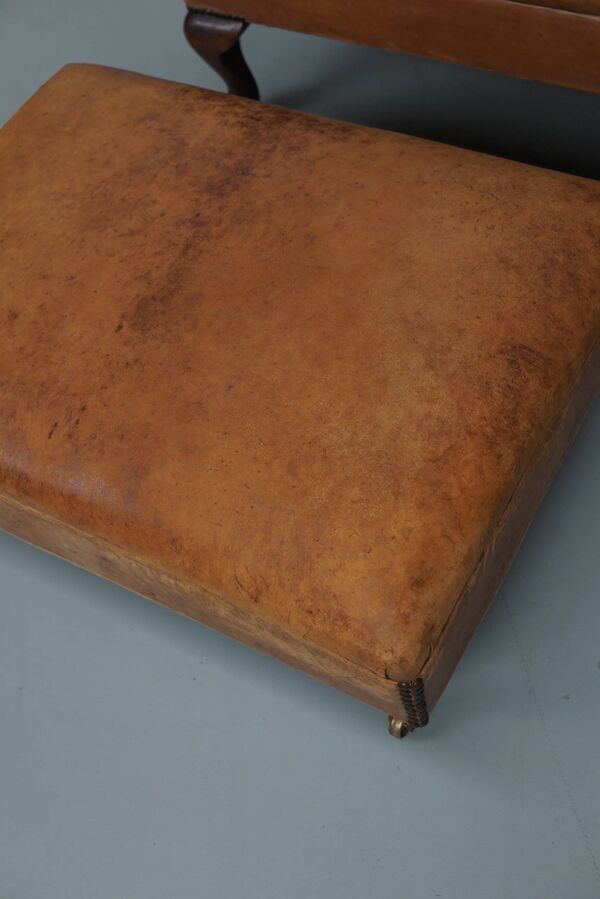 Fauteuil club vintage hollandais en cuir couleur cognac, avec repose-pieds