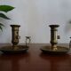 Pair of vintage brass pusher candle holders