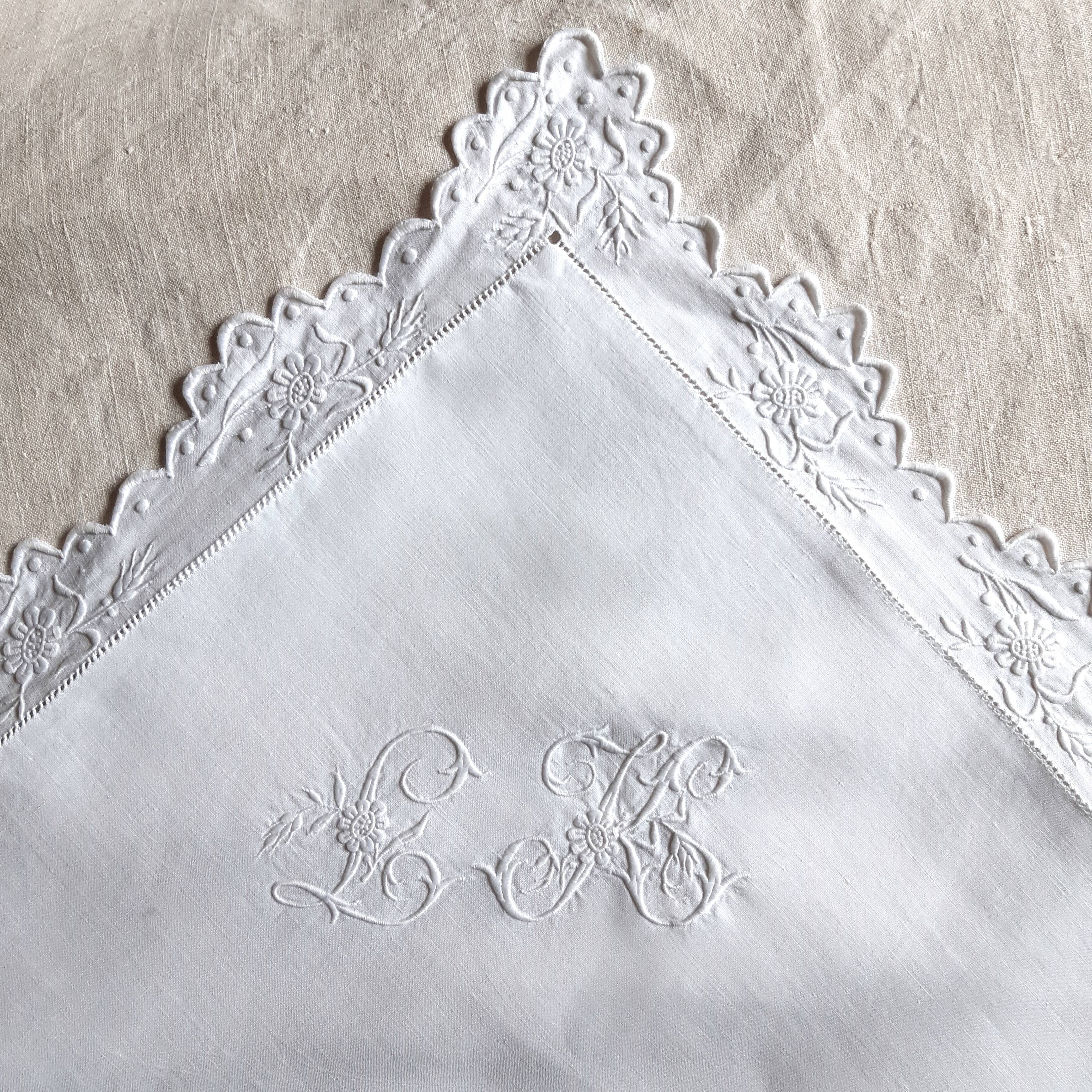 pillowcase embroidered with flowers and monogrammed festoons LK