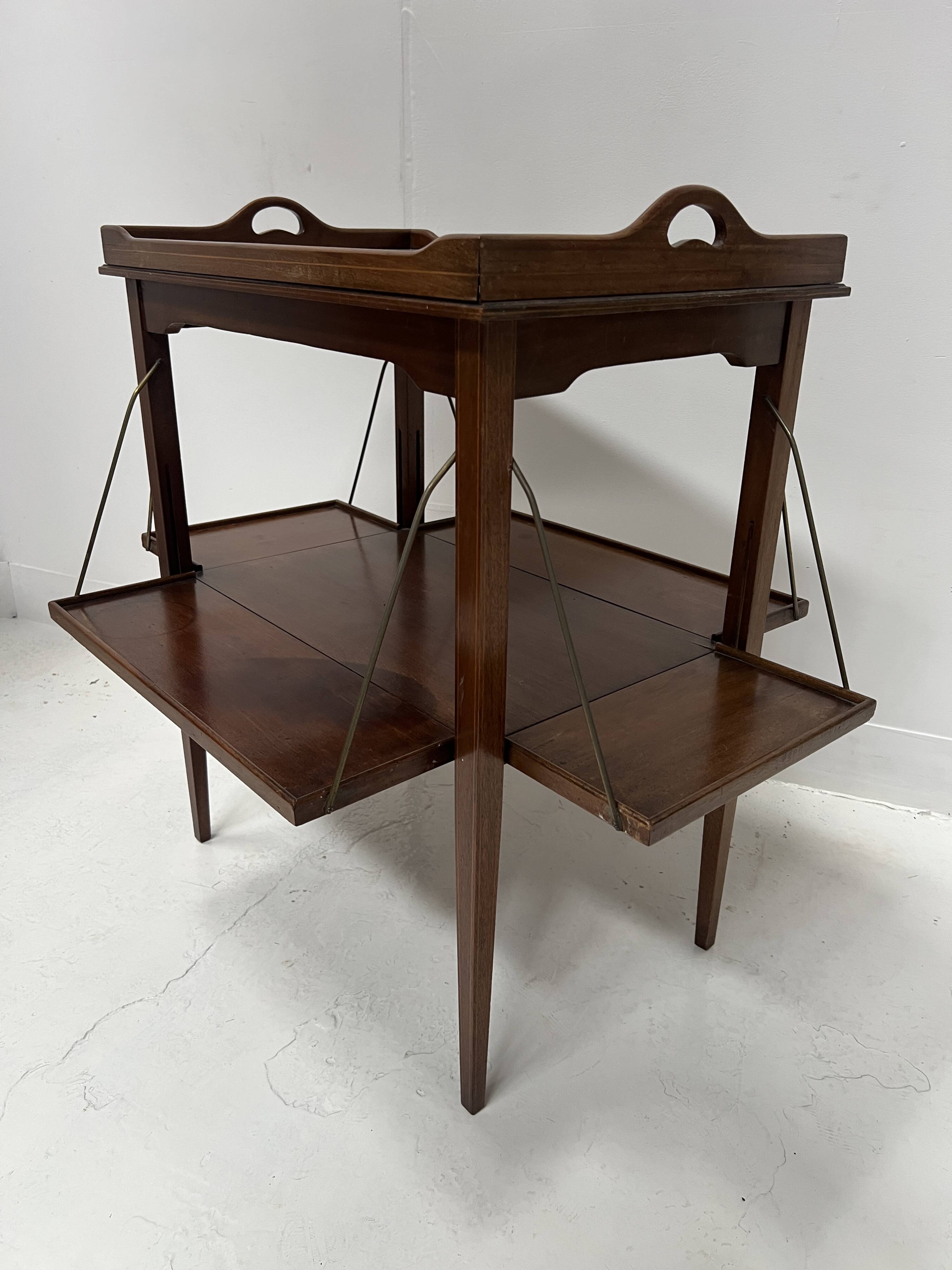 Mahogany serving table with marquetry inlay decoration, 20th century.