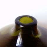 Small dark green handmade glass ball vase