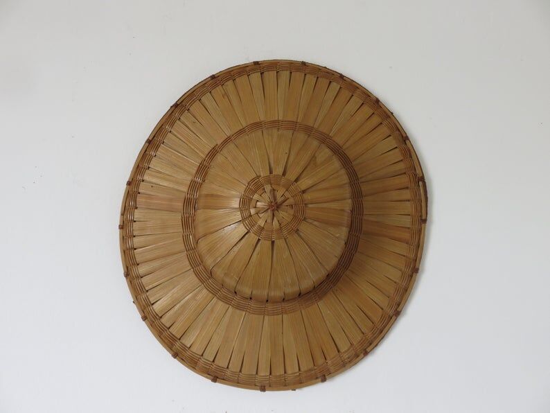 Colonial hat in bamboo and braided rattan, wall decoration