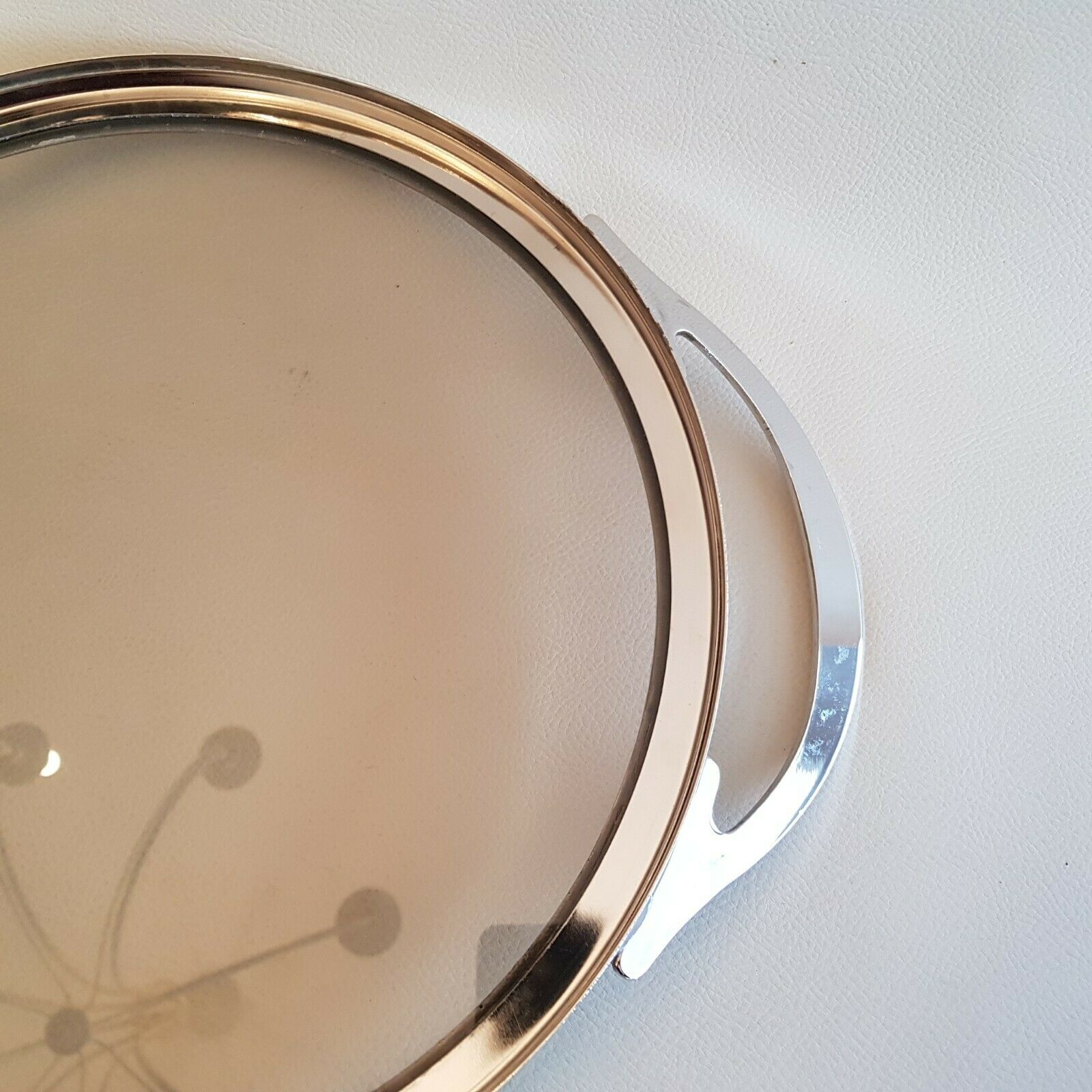 Round glass and art deco silver metal tray