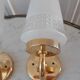 Pair of glass and gilded metal sconces 50s