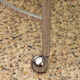 Two-tier swivel coffee table in chromed steel and crystal, 1970s