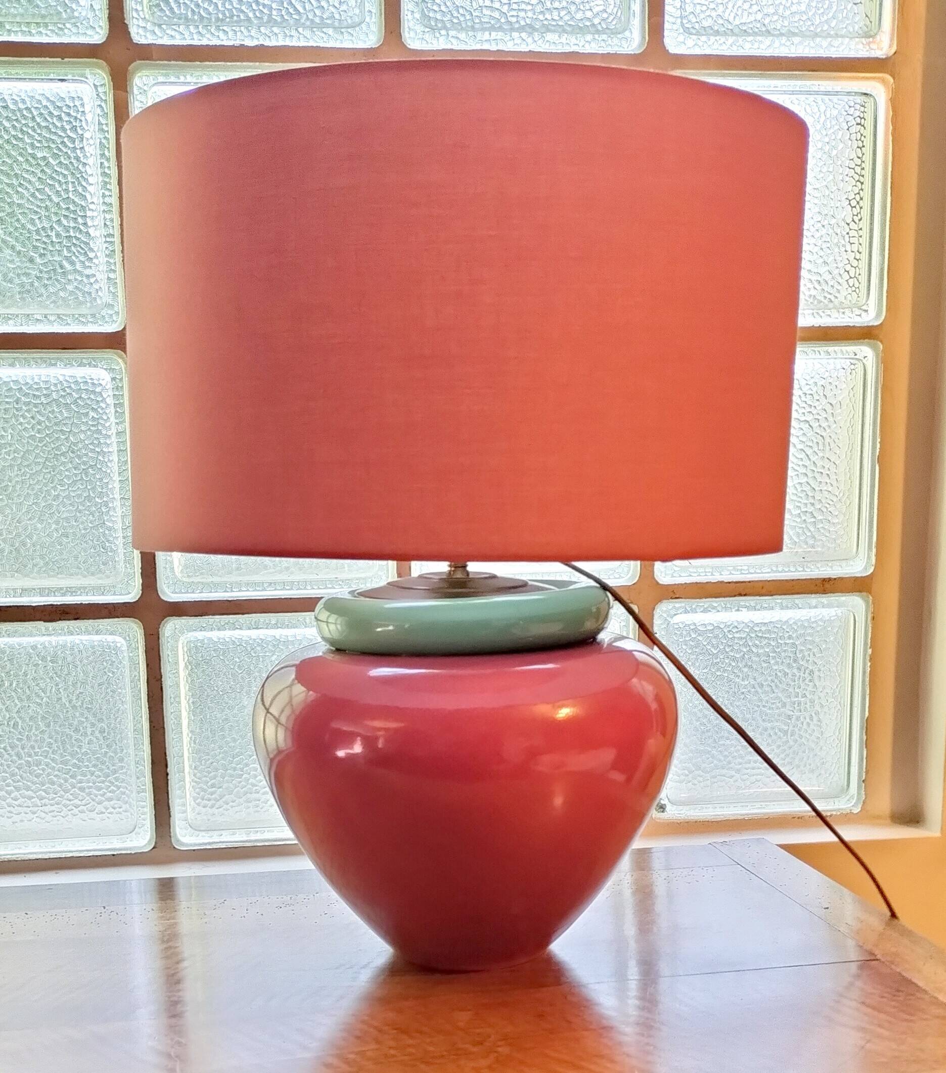 Inverted "mirror" pair of large red and green ceramic lamps.