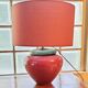 Inverted "mirror" pair of large red and green ceramic lamps.