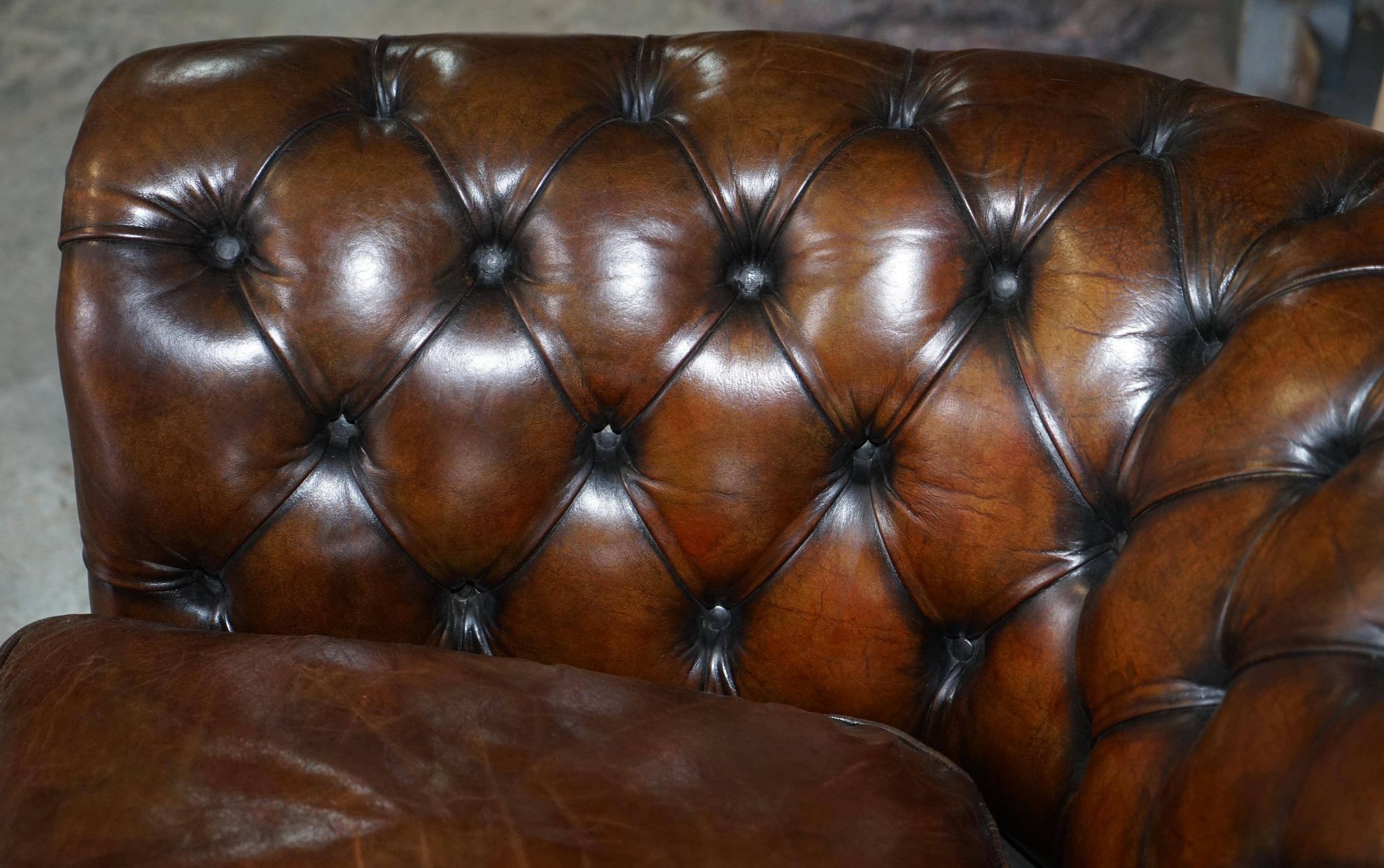 Restored leather Chesterfield sofa, walnut legs.