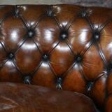 Restored leather Chesterfield sofa, walnut legs.