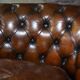 Restored leather Chesterfield sofa, walnut legs.