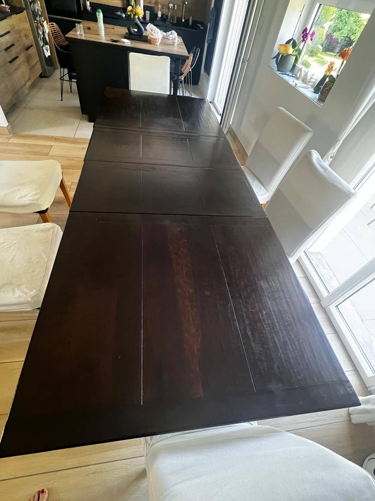Solid cherry wood dining table, extendable for 8 to 12 people.