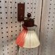 Scandinavian design wall light in teak and brass from the 1950s.
