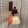 Scandinavian design wall light in teak and brass from the 1950s.