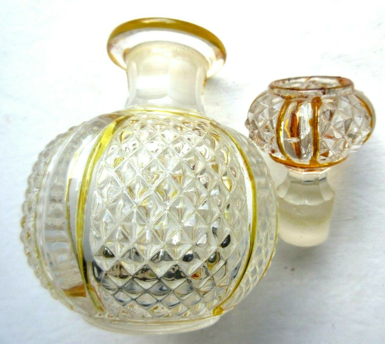 Baccarat perfume bottle, yellow eds and diamond tips