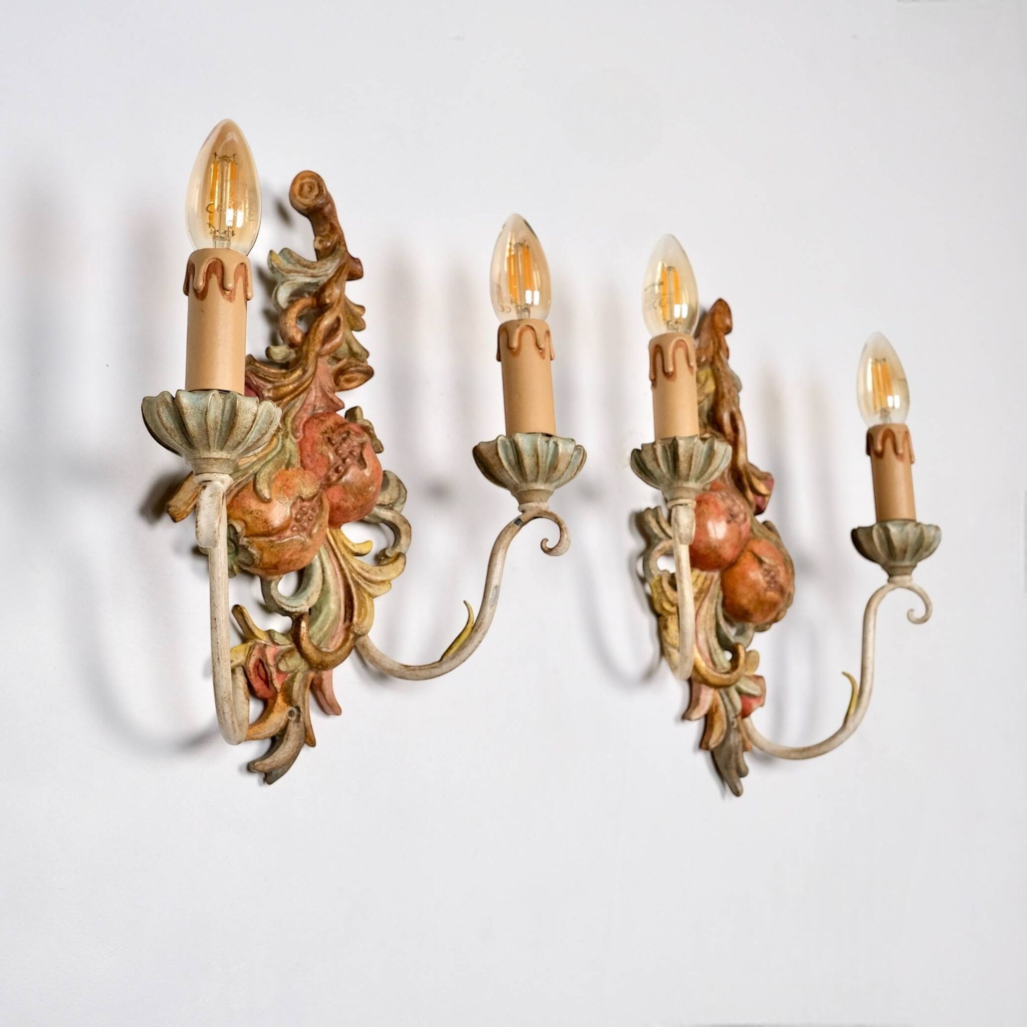 Pair of carved wood and metal sconces, Chelini FIrenze, Italy