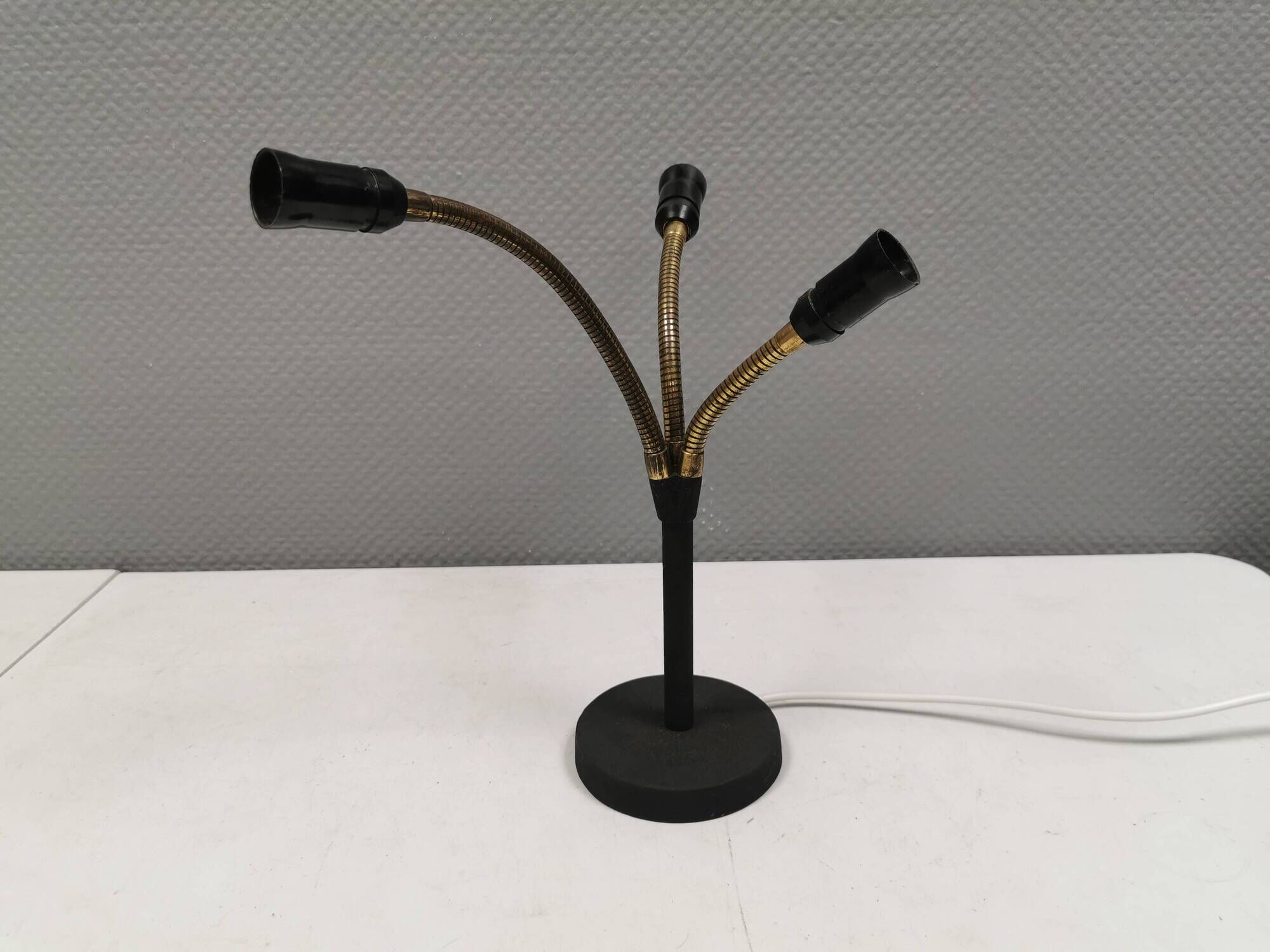 Old cast iron table lamp with brass bend and 3 light sources