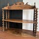 Antique wall shelf made of turned wood and spools of thread, late 19th century.