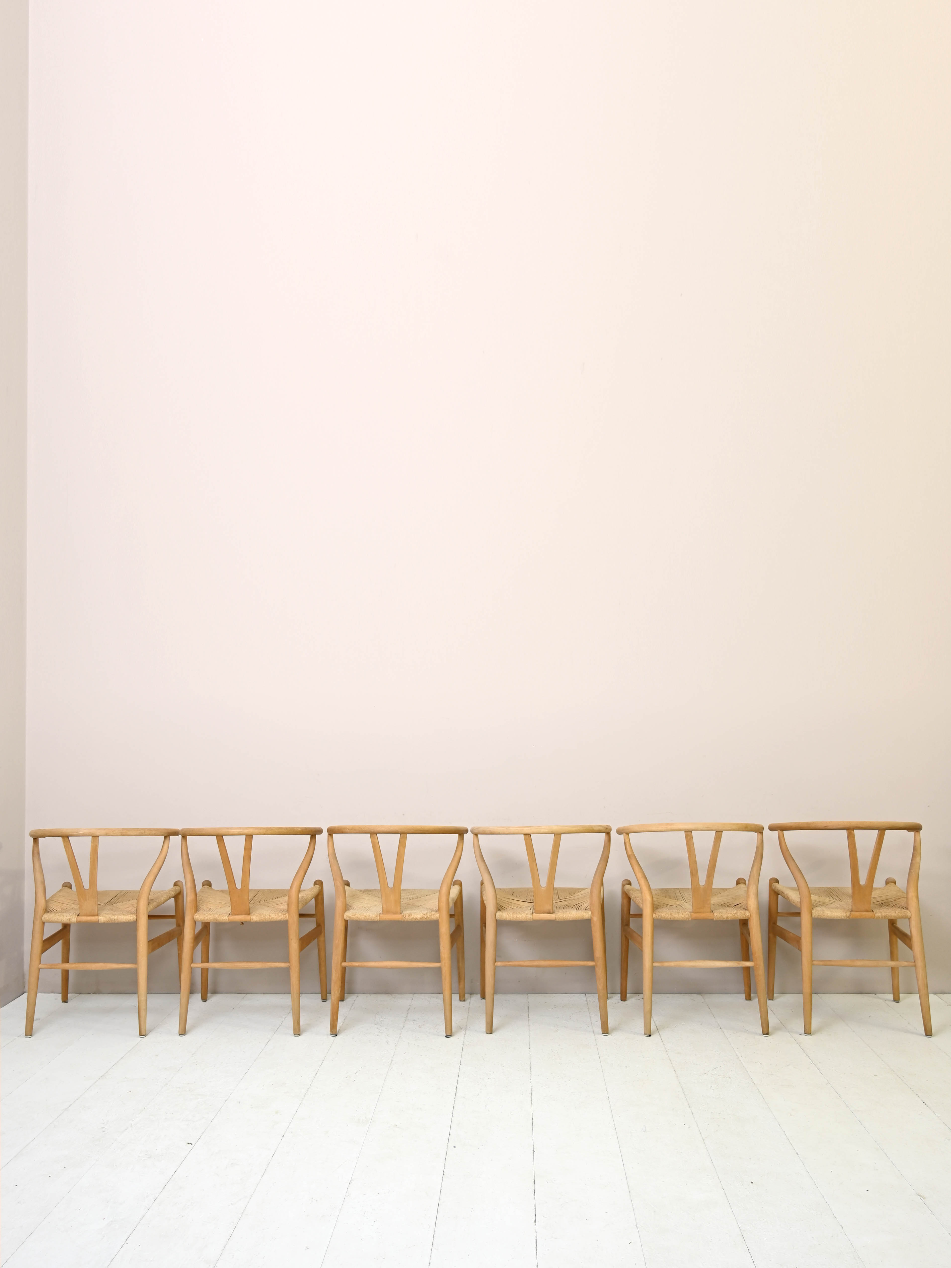 Set of six 'Wishbone chair' model chairs by Hans J. Wegner with leather cushions