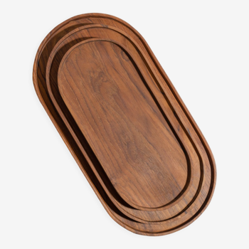 Trio of oval teak trays or cups