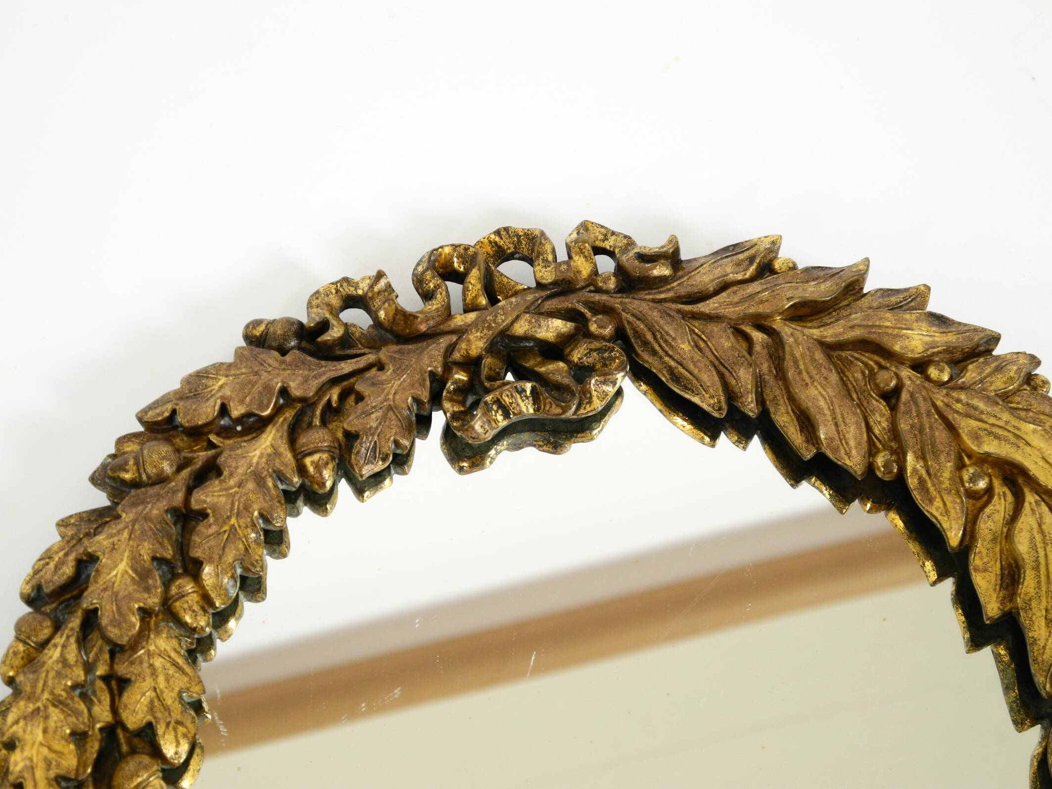 Beautiful small French mid-century wall mirror with an ornate brass frame