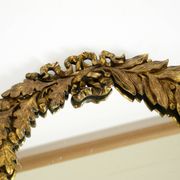 Beautiful small French mid-century wall mirror with an ornate brass frame