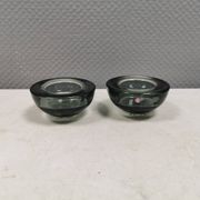 A set of iitalla candle holders in smoked transparent glass.