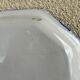 Antique octagonal plate in blue and white pottery with bird decoration.